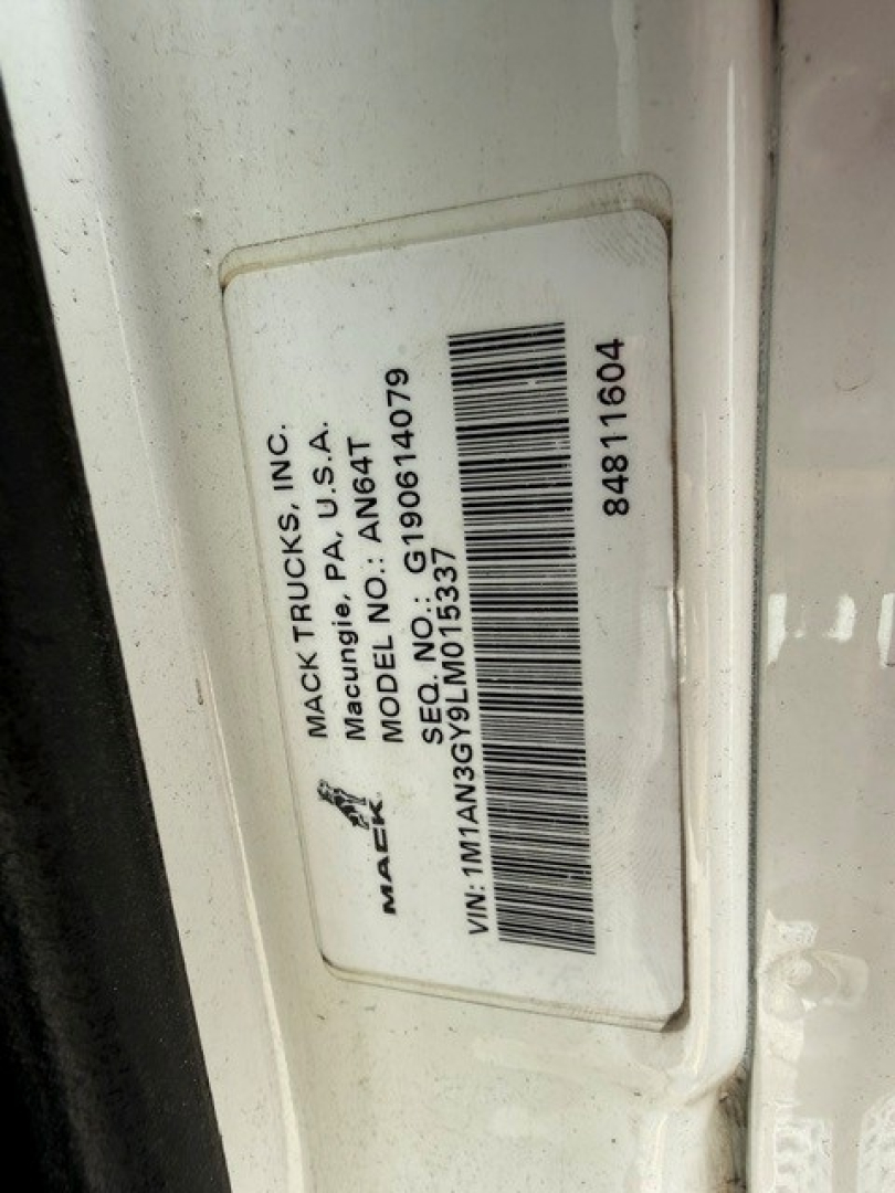 Mack label on door jamb with VIN and model information: MACK TRUCKS INC, MANUFACTURING, MODEL NO. 1M1AN3GY9LM015337, SERIAL/SEAL barcode 848 110604, MACK TRUCKS label.