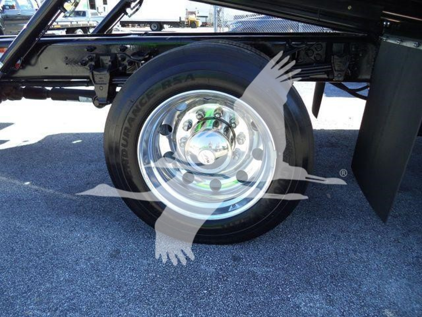 Wheel and tire on Ford F750 cab chassis showing Dunlop windshield? Actually text visible: 'DUNLOP' on tire sidewall and chrome wheel. No other legible text visible in image.