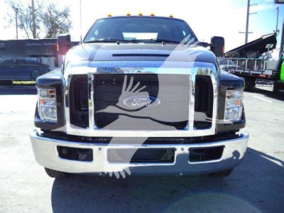 Ford F-750 rollback truck front view showing chrome grille and headlights