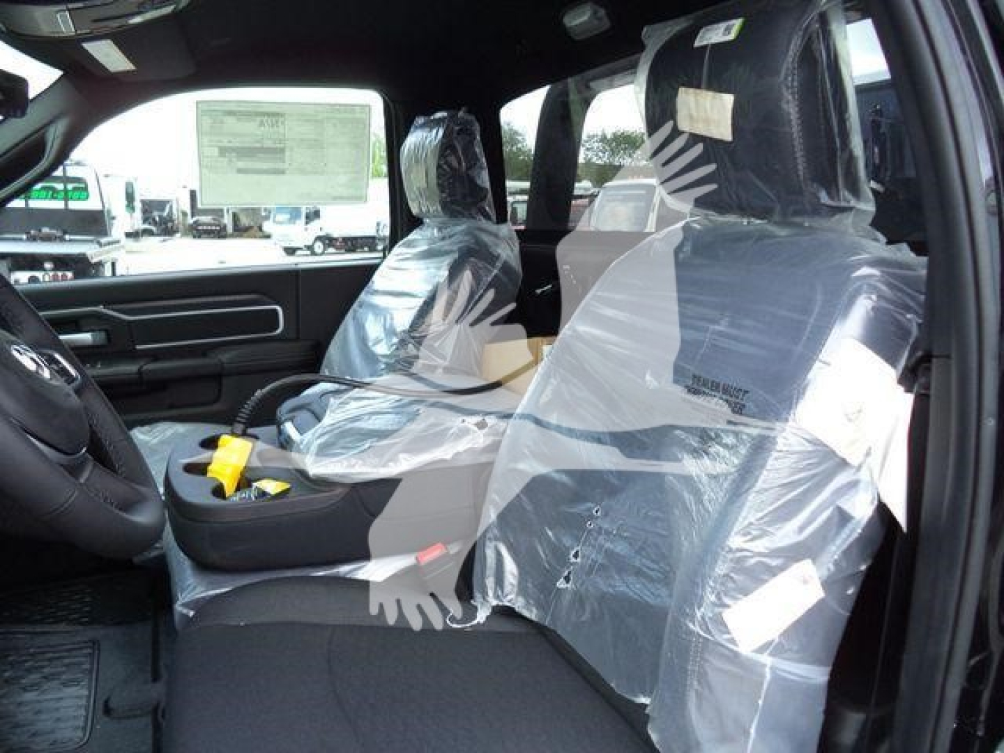Ram 4500 Big Horn interior with plastic seat covers, driver and front passenger seats visible.