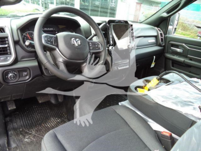 Interior of 2026 Ram 4500 Big Horn truck showing steering wheel, dashboard, center touchscreen, and front seats.
