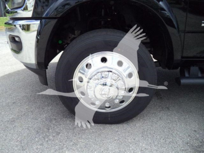Ram 4500 wheel and tire view with chrome hubcap and black fender in a winch-equipped truck.