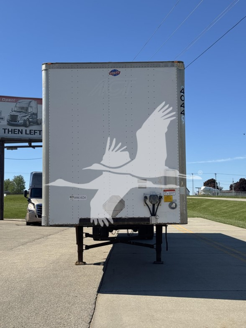 Trailer back showing graphic of two birds in flight on a white surface with landing gear visible.