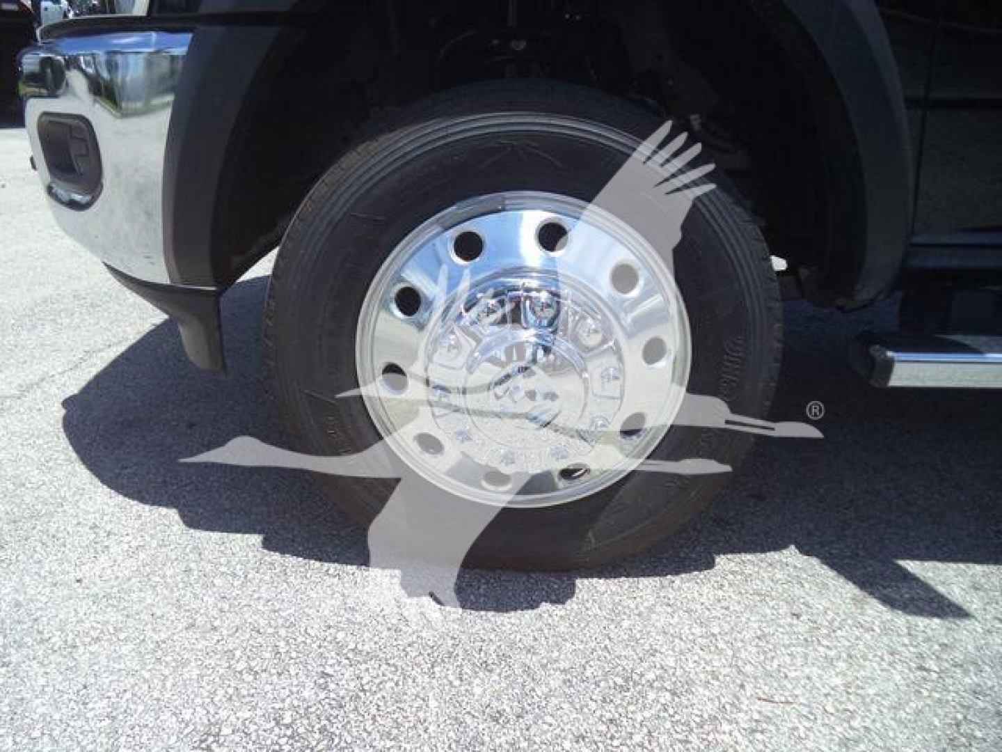 Wheel and hub of a Ram 4500 front axle showing chrome polished wheel and tire.