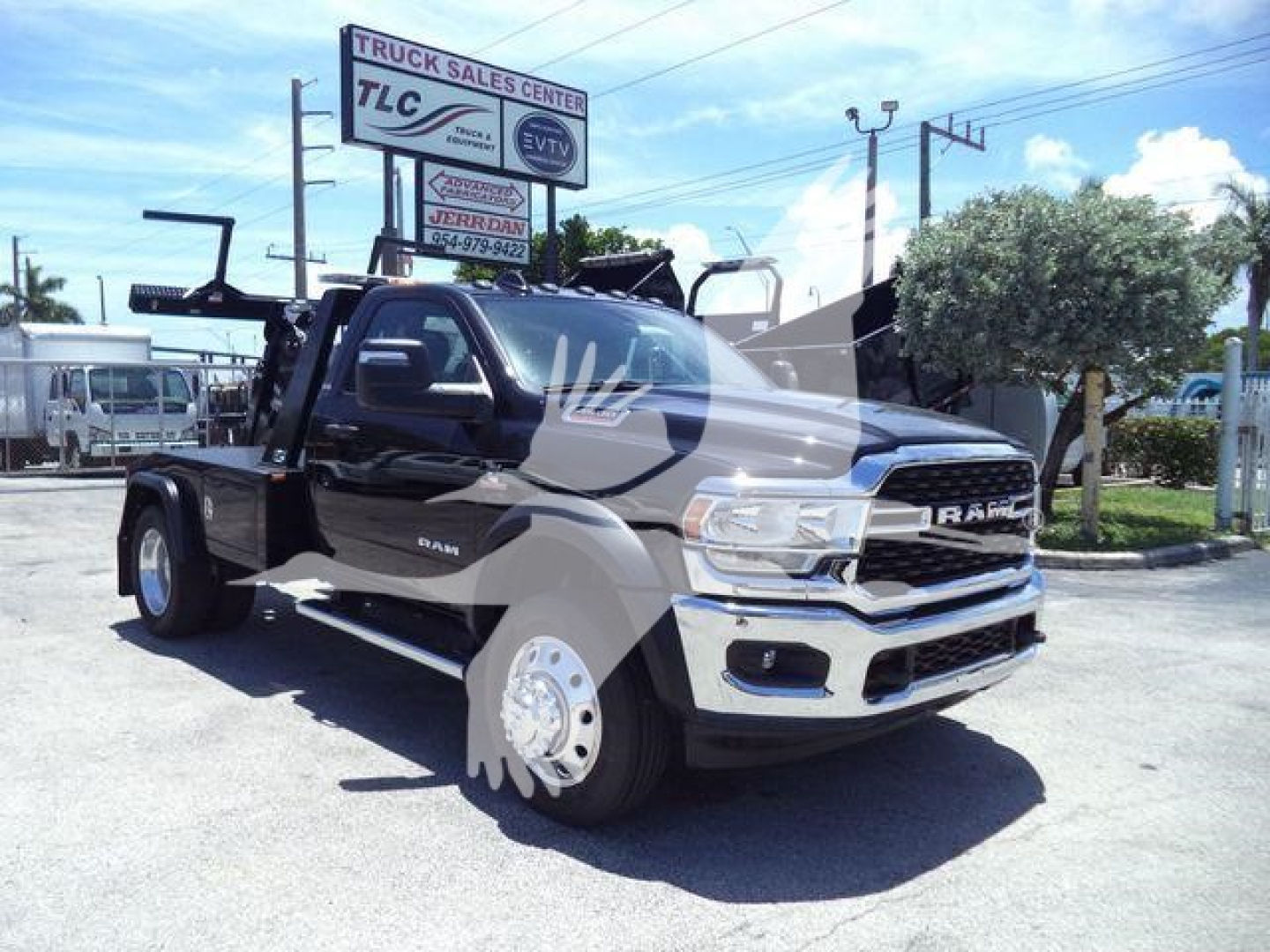 Ram 4500 SLT truck in a dealership lot showing heavy-duty front grille and winch equipment visible on a flatbed, stock number J98322FM