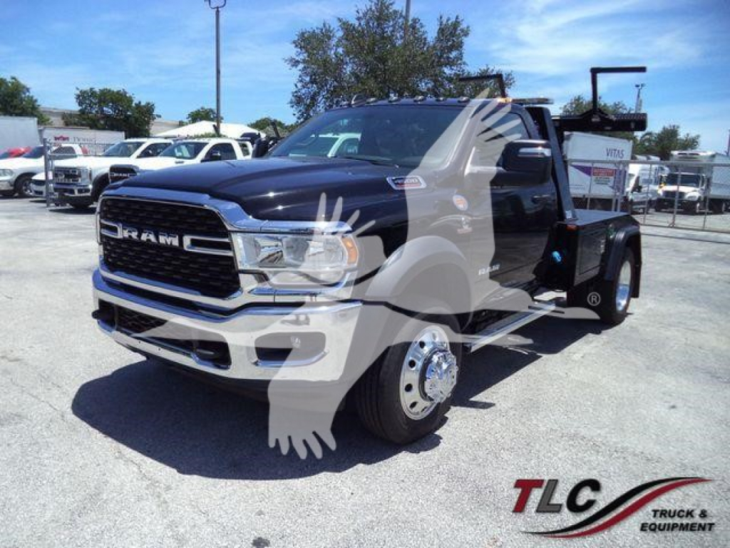 Ram 4500 truck with a winch setup, front grille, and dual rear wheels visible in a dealership lot.