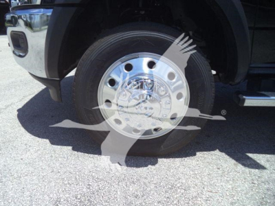 Wheel and hub of a Ram 4500 front axle showing chrome polished wheel and tire.