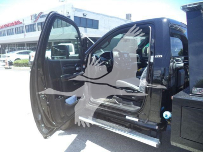 Ram 4500 SLT truck interior with front door open, showing driver seat and dashboard, side step visible