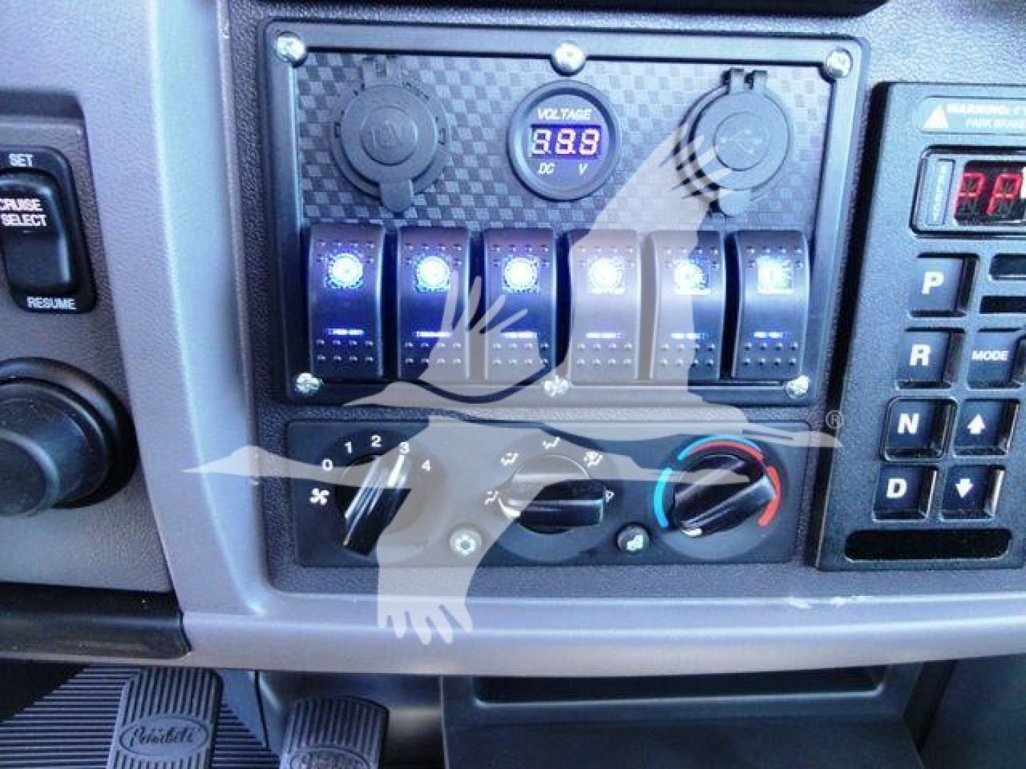Dashboard controls and toggles in Peterbilt 337 cab showing gauge cluster and climate controls.
