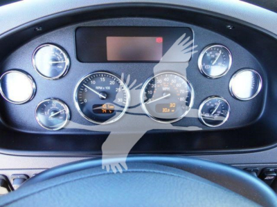 Peterbilt 337 dashboard view showing gauges and digital display with steering wheel.