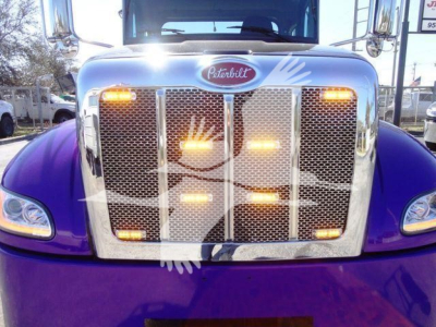 Peterbilt 337 front grille with chrome grille and purple bumper, hood emblem visible.