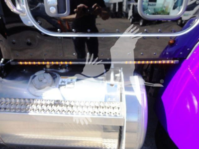Peterbilt 337 rollback truck fuel tank area showing chrome exhaust/saddle fuel tank and steps.