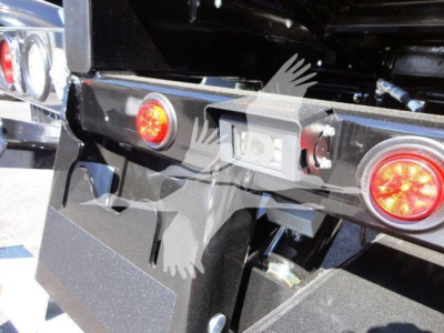 Peterbilt 337 rollback hitch area showing rear lights and license plate area with wiring harness and frame components