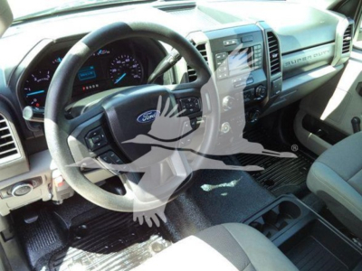Ford F-550 interior view showing steering wheel, dashboard, and center console with touchscreen display.