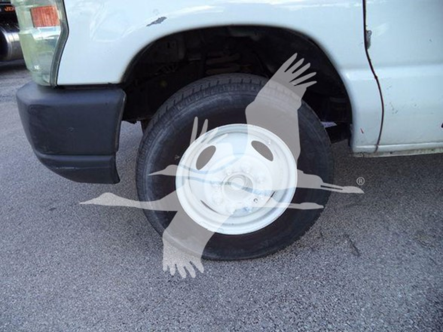 Ford E450 dump truck front wheel and fender with tire