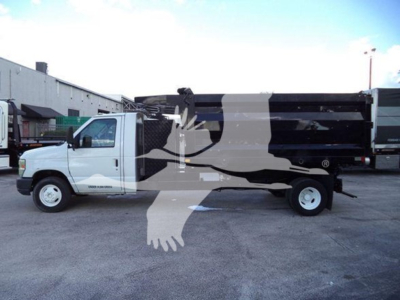 Truck side view of a 2011 Ford E450 dump truck showing cargo bed and wheels with stock number T20696 visible.