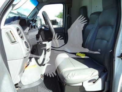 Ford E450 interior cab view showing driver and front passenger seat and dashboard area.