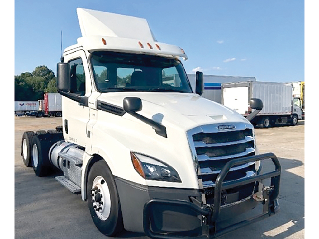 Freightliner Cascadia126 Daycab truck in a yard.