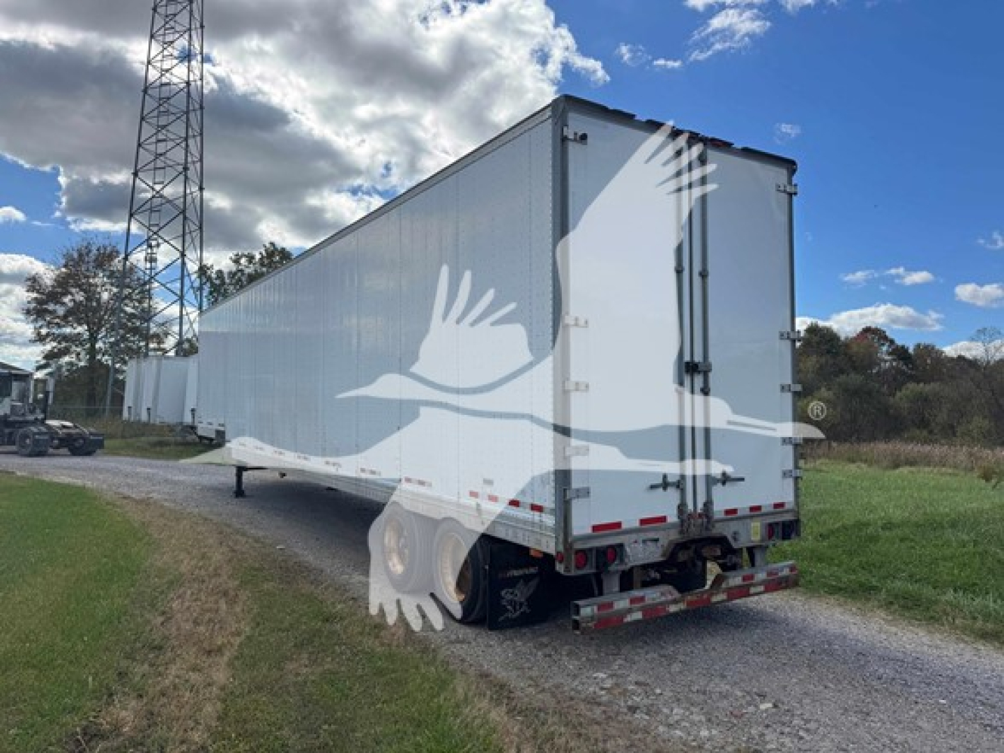 Manac 2015 48' drop van trailer viewed from rear-left side showing dual rear doors and heavy-duty trailer frame.