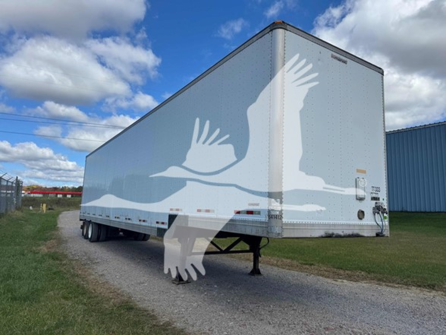 Manac 48' drop van trailer in view showing side and rear, with silhouettes watermark overlay.