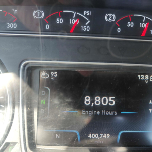 Dashboard of a 2021 International LT showing engine hours 8,805, 400,749 miles, outside temp 95°F, transmission position N, and gauges including PSI and temperature.