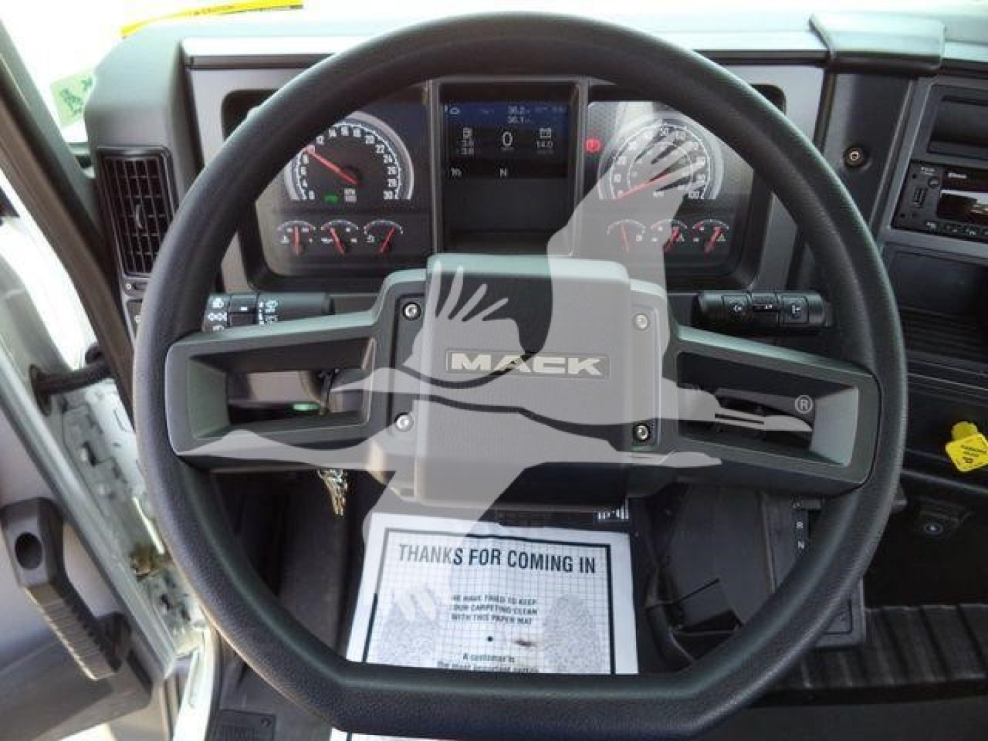 Mack MD6 truck cockpit with steering wheel and dashboard view