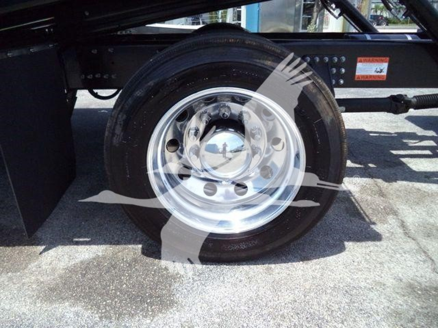 Mack MD6 truck wheel showing aluminum rim and tire sidewall