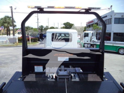 Mack MD6 rollback truck bed with hoist, rear view showing Jerr-Dan equipment and metal diamond plate deck.