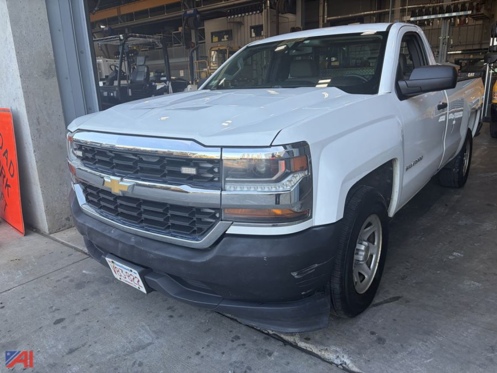 Chevrolet Silverado 1500 pickup truck in white, 2WD, front-left view showing Silverado badge and chrome grille.