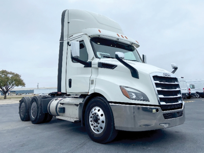 Truck cab showing Freightliner Cascadia 116 sleeper in white with chrome bumper and dual rear axles, VIN 3AKJHTDV4MSMH9198 visible on listing.