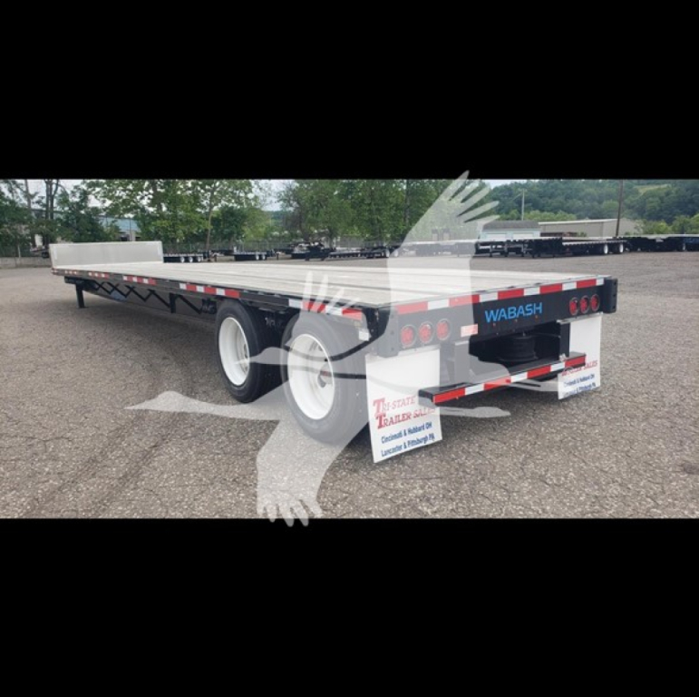 2024 Wabash Steel Drop-Closed Tandem trailer showing rear with WABASH branding, taillights, mudflaps, and dual axles.