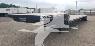 Trailer side view showing a long flatbed drop deck trailer with black painted frame and red/white reflective tape along the edge.