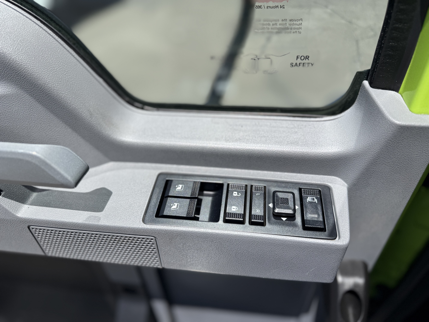 Truck interior door panel with window/lock controls visible, part of a Mack AN64T cab door.