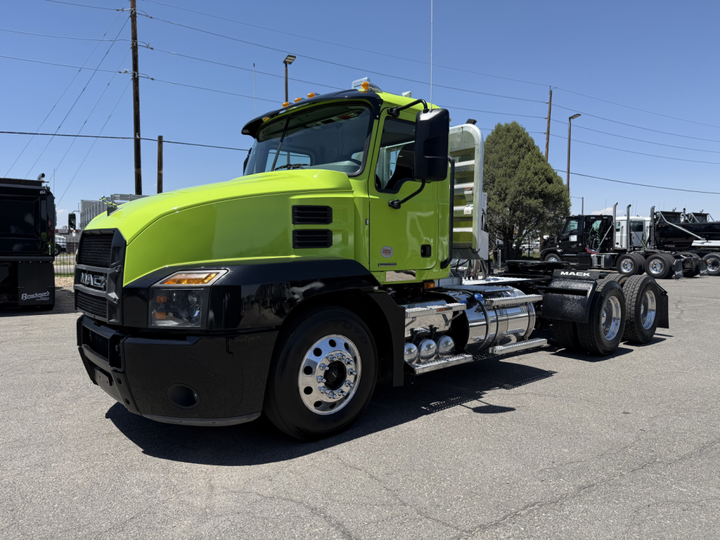 Mack AN64T conventional daycab truck in lime green and black paint profile showing front and side view with fuel tanks and dual rear axles.