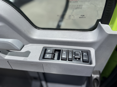 Truck interior door panel with window/lock controls visible, part of a Mack AN64T cab door.