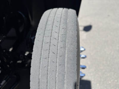 Mack AN64T truck view showing tire tread and wheel well with vertical lines