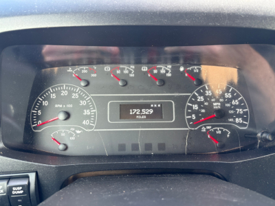 Truck dashboard showing instrument cluster with RPM gauge, speedometer, and mileage reading 172,529 miles. Various small gauges on top and right, with black face and white markings.