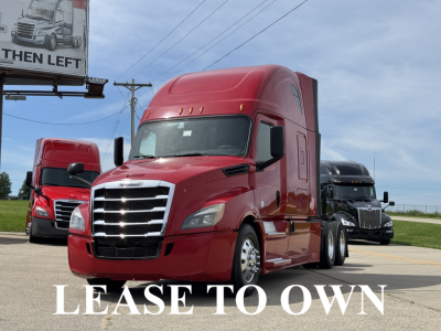 Freightliner Cascadia 126 sleeper cab truck in red, parked with other trucks in background, captioned ‘LEASE TO OWN’ across bottom.