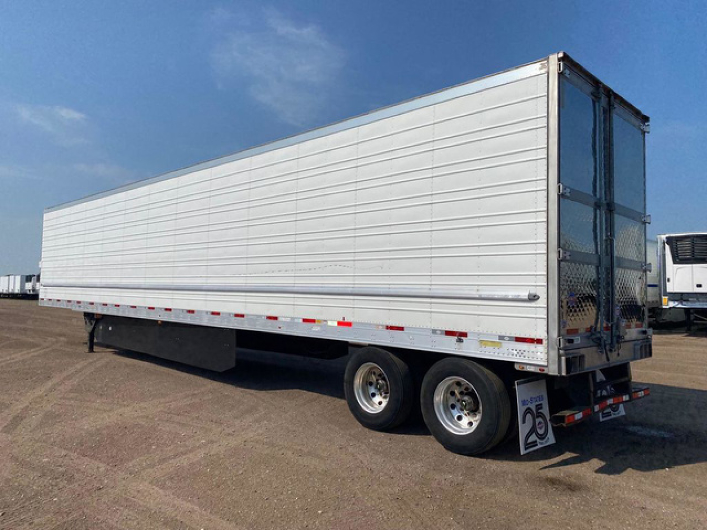 Trailer side view showing a white refrigerated utility trailer with tandem axles and rear doors, stock number U91109, category Refrigerated.