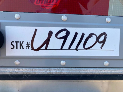 Stock label on trailer showing STK # U91109 handwritten.