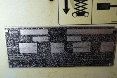 JLG 2646ES scissor lift nameplate close-up showing model and serial numbers and ratings plate.