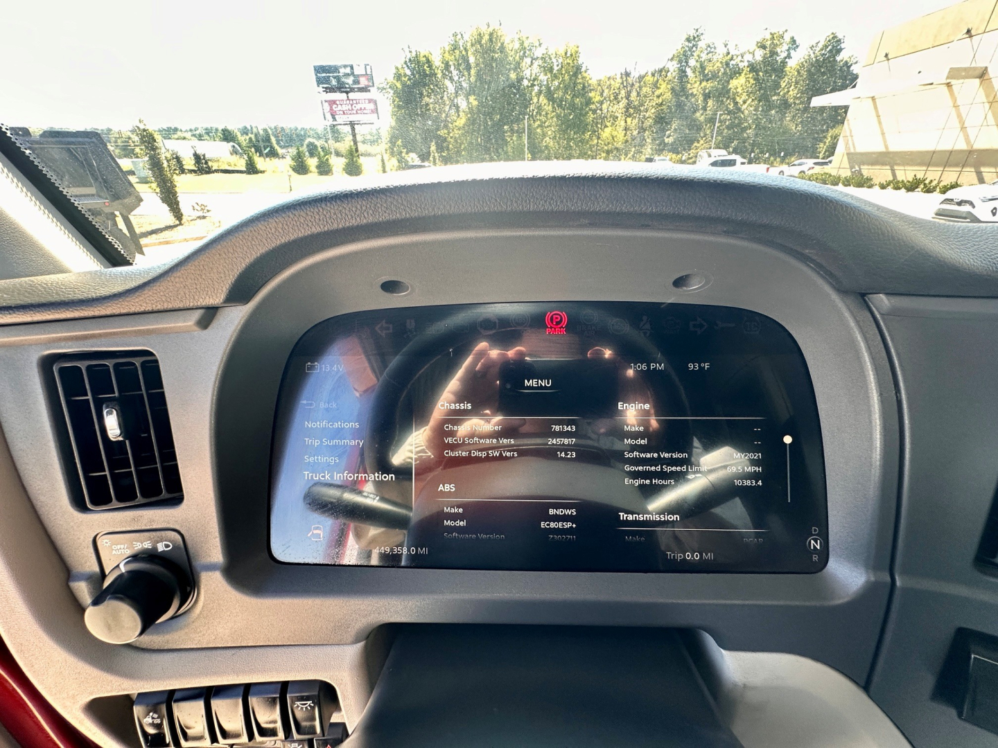 Peterbilt 579 dashboard display screen showing vehicle status and menu options inside cab, with steering column and control stalks visible.