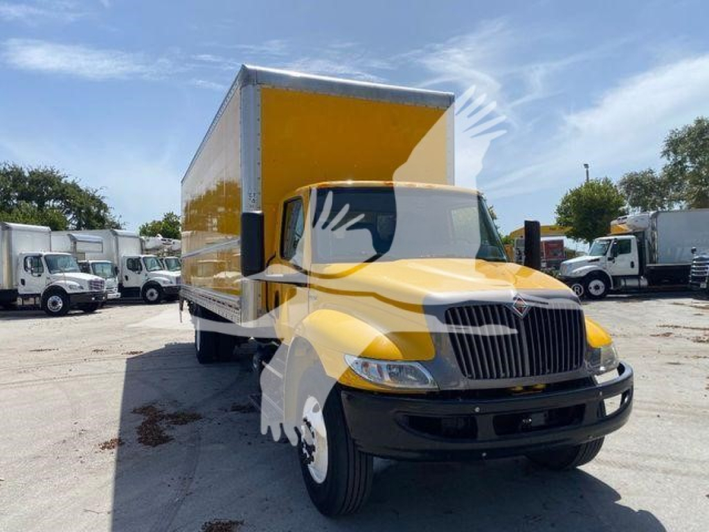 Tow truck with a yellow cargo box and black front, International MV model, box truck, front view showing cab and cargo box.
