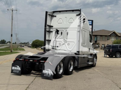 Truck rear view of a 2022 Freightliner Cascadia 126 tractor with sleeper, dual rear wheels, mud flaps, and white cab, stock number 2502015.
