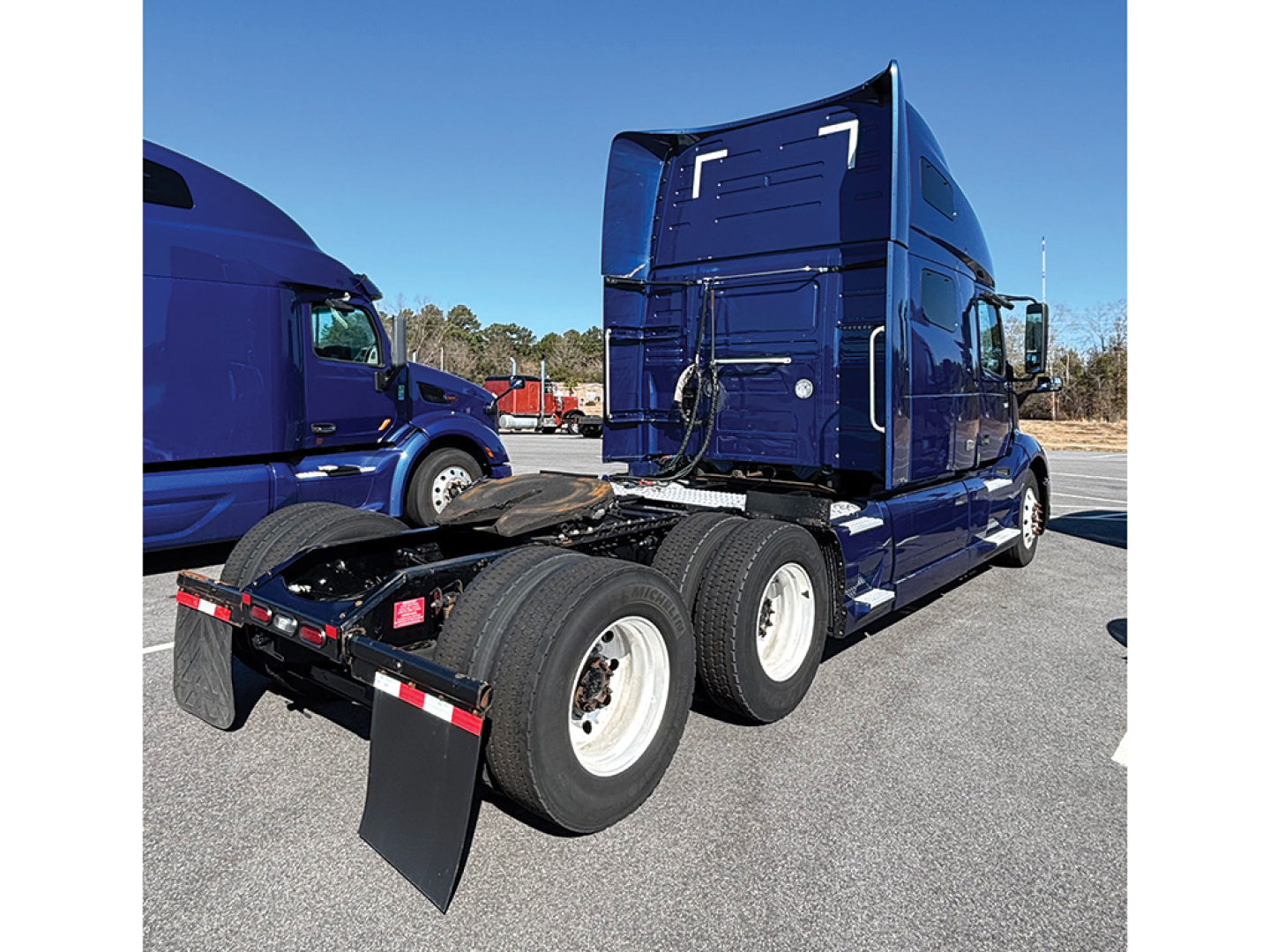 Volvo VNL 760 tandem tractor rear view showing sleeper cab, dual rear axles, and fifth-wheel attachment.