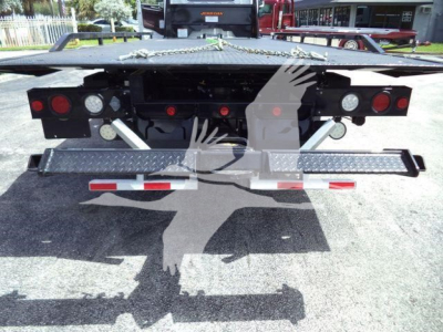 Rear view of a 2026 Hino L6 rollback truck showing the rear bumper, taillights, and loading platform.