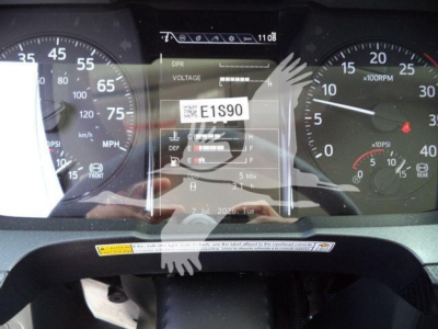 Dashboard display showing E15S90 voltage/readout label and instrument cluster with speedometer and tachometer