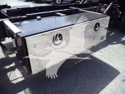 Hino L6 rollback truck bed toolbox on chassis with metal toolbox and reflective surface, side view.