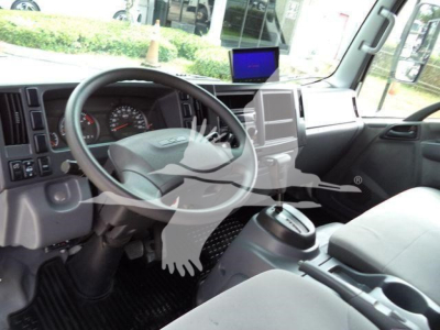 Interior of a 2017 Chevrolet W4500 dump truck cab showing steering wheel, dashboard, center console, and gear selector.