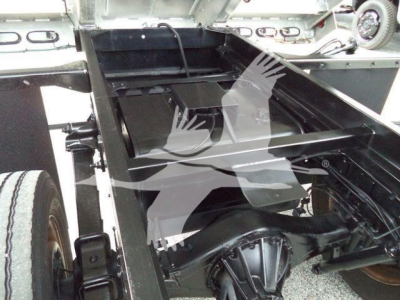 Chevrolet W4500 dump truck chassis showing open bed and rear axle components